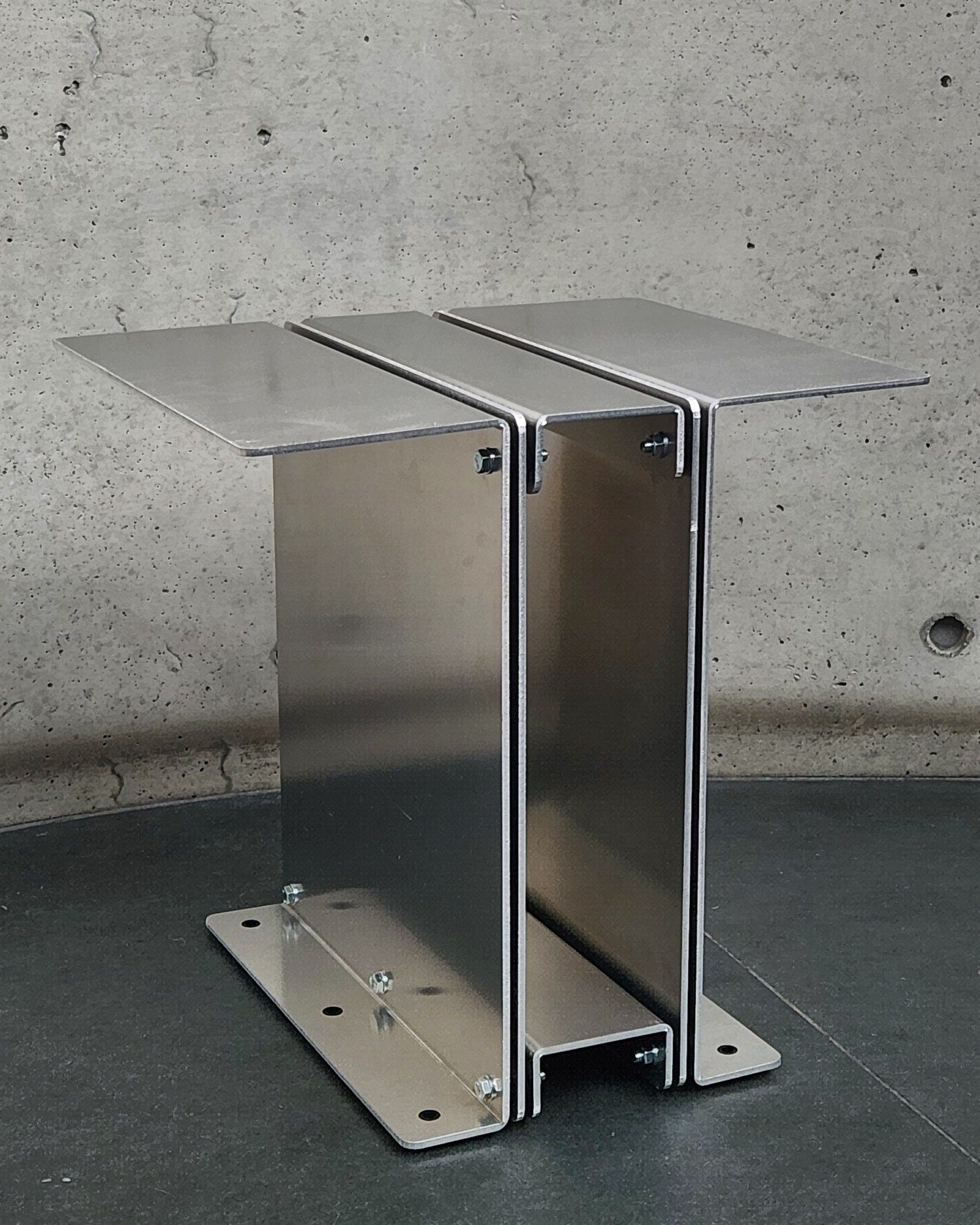 3082 Book Table empty on a concrete floor, three-quarter view