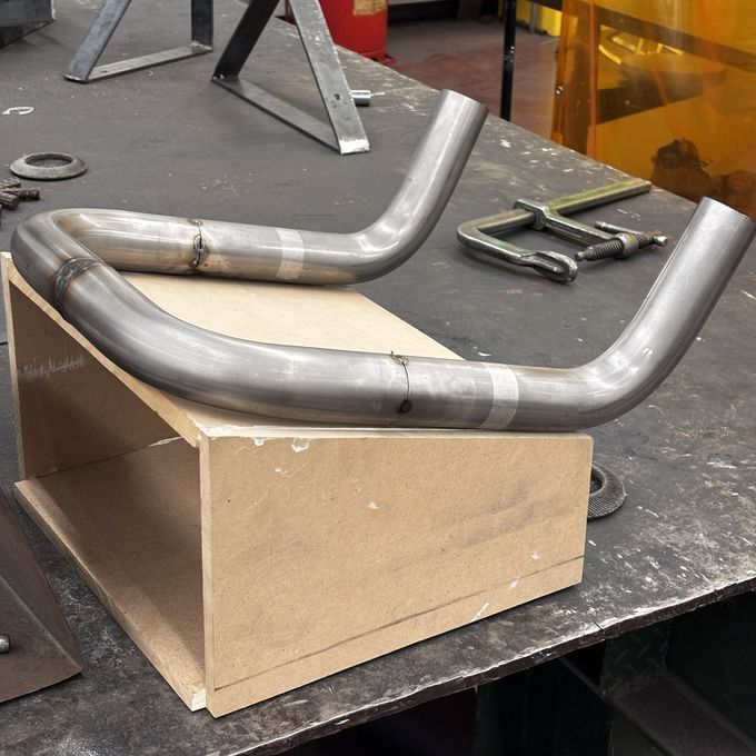 MC_01 build archive: Early welding · one loop, on a cut MDF jig